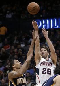 Atlanta Hawks guard Kyle Korver (26) releases a 3-point shot as Indiana Pacers point guard George Hill defends (AP Photo/John Bazemore, File)