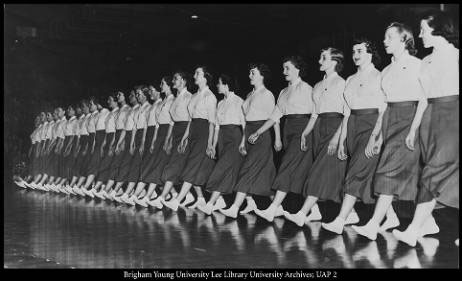 The Cougarettes, the female marching group, perform in the George Albert Smith Fieldhouse in 1953. 