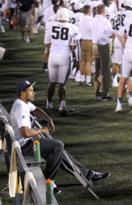 Utah State quarterback Chuckie Keeton sits on the bench after injuring his leg during an NCAA football game against Wake Forest, Saturday, Sept. 13, 2014, in Logan, Utah. (AP Photo/Eli Lucero)
