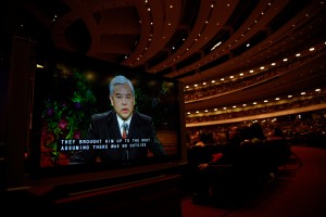 Elder Chi Hong (Sam) Wong of the First Quorum of the Seventy speaks in his native language of Cantonese at the Saturday morning session of general conference as the congregation listens and views English captions on screens in the Conference Center, 4 October 2014. Those watching the broadcast around the world heard Elder Wong’s talk in their own language. (Mormon Newsroom)