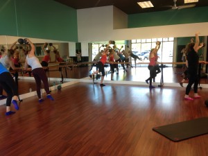 Rachel Parkinson teaches a fun Pilates-dance mixed class at Xtend Barre to girls from the Provo/Orem area. (Photo by Alex Olpin)