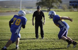Pahranagat Valley Panthers head coach Ken Higbee directs his team during practice. (AP Photo/John Locher)