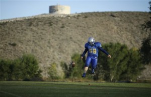 Panthers player Chandler Palmer kicks a football during practice. (AP Photo/John Locher)