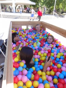 Students socialize in the October ball pit at Brigham Square. They ask each other questions written on the balls like, "how old are you?" and "what is your best scar story?" (Cara Wade)