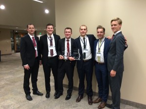 Gray , Travis Glock, Adam Long, Isaac Stevens, Seth Ferguson and Kindall Palmer pose with their winning plaques. The students made competed with the BYU Spanish and Chinese teams at the business case competition.  (Erica Palmer)