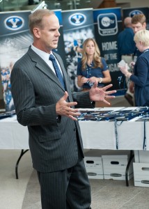 Holmoe speaks with a group of people during registration of the 2012 Media Day at BYU. (Chris Bunker)