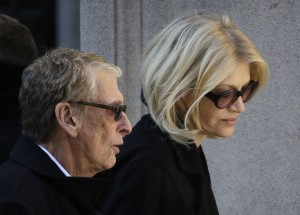 FILE - In this Feb. 7, 2014, file photo, director Mike Nichols, left, and Diane Sawyer arrive for the funeral of actor Philip Seymour Hoffman at the Church of St. Ignatius Loyola in New York. Nichols, the director of matchless versatility who brought fierce wit, caustic social commentary and wicked absurdity to such film, TV and stage hits as "The Graduate," `'Angels in America" and "Monty Python's Spamalot," died Thursday, Nov. 20, 2014. He was 83. (AP Photo/Mark Lennihan, File)