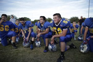 Pahranagat Valley Panthers players listen to their coach after practice in Alamo, Nev. (AP Photo/John Locher)