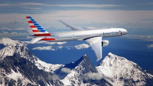An American Airlines commercial jet soars through the air. Many modern airlines are implementing new technology to enhance the travel experience for passengers. (Photo by American Airlines)