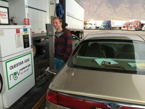 Ryan Freeman, a senior studying English, fills up his car with compressed natural gas. Freeman uses it because of how cheap it is compared to regular gasoline; he filled up is car for $7.96. (Frank Young)