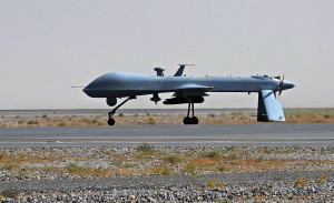 FILE - In this June 13, 2010, file photo a U.S. Predator unmanned drone armed with a missile stands on the tarmac of Kandahar military airport in Afghanistan. Today, when U.S. intelligence agencies believe they know the location of a terrorist in Pakistan and a few other countries, they are largely free to deploy a weapon that's become the symbol of war on terror: an aerial drone. The drone drops a bomb or fires a missile that executes the suspect. University of Utah law professor Amos Guiora is pushing for another step before the U.S. government or military could decide to kill a terror suspect with a drone. In a proposal to be published in 2015, Guiora and a colleague are pushing for what they call a "drone court." The court would be part of the judiciary branch and hear arguments for why the United States should target a suspect with a drone strike.(AP Photo/Massoud Hossaini, Pool, File)