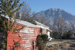 In this photo taken Nov. 17, 2014, this home in Provo, Utah,is about to be demolished. It will be the last on that street to be destroyed to make way for a hospital expansion and new power plant. (Lucy Schouten)