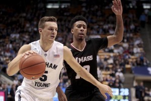 Kyle Collinsworth drives the ball against a UMass defender. (AP Photo)
