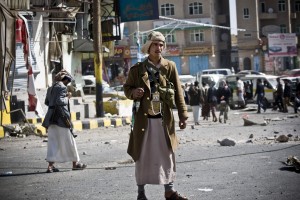 Houthi Shiite Yemeni gather while guarding a street leading to the presidential palace in Sanaa, Yemen, Jan. 20. Yemen's U.S.-backed leadership came under serious threat Monday as government troops clashed with Shiite rebels near the presidential palace and a key military base in what one official called "a step toward a coup." (AP Photo/Hani Mohammed)