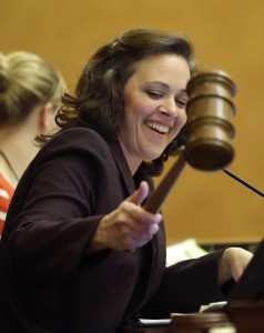 Speaker of the Utah House of Representatives, Becky Lockhart, uses a gavel after finishing business at the Utah State Capitol. Lockhart, the first female speaker in the history of the Utah House of Representatives, has died of a rare brain disease at the age of 46. (AP Photo/Rick Bowmer, File)