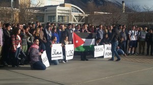 Students gather in Brigham Square on the east side of the Harold B. Lee Library to hold a vigil for the Jordanian pilot who was burned alive by ISIS. (Nalia Tafual)
