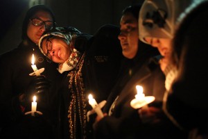 Nida Allam, a senior at North Carolina State University, rests her head on Asheen Allam, during a vigil for three people who were killed at a condominium near UNC-Chapel Hill, Wednesday, Feb. 11, 2015, in Chapel Hill, N.C. Craig Stephen Hicks appeared in court Wednesday on charges of first-degree murder in the deaths Tuesday of Deah Shaddy Barakat, his wife Yusor Mohammad and her sister Razan Mohammad Abu-Salha. (AP Photo/The News & Observer, Al Drago)