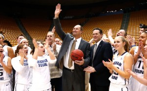 Head coach Jeff Judkins receives the game ball on his 300th win at BYU. 