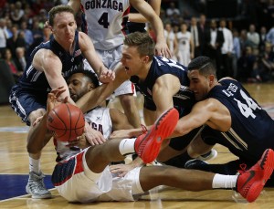 BYU's Skyler Halford, Jake Toolson, and Corbin Kaufusi scramble for the ball with Gonzaga's Byron Wesley in the West Coast Conference tournament championship. (AP Photo/John Locher)