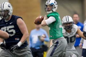 BYU quarterback McCoy Hill lines up a pass during the first day of spring football camp. Hill sprained his foot later in the day. (Spenser Heaps) 