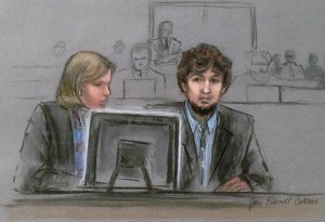 In this courtroom sketch, Dzhokhar Tsarnaev, right, and defense attorney Judy Clarke are depicted watching evidence displayed on a monitor during his federal death penalty trial. (AP Photo)