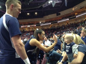 BYU cheerleader Molly Harmon high-fives a BYU fan during the 2015 WCC championship game. (Tori Crane)
