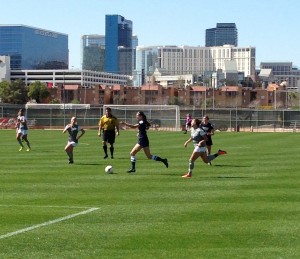 The BYU women's soccer team dribbles the ball against UNLV in Las Vegas on March 7, 2015. (J Mason Nordfelt).