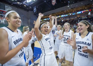 (From left): Morgan Bailey, Xojian Harry, Micaelee Orton and Cassie Broadhead celebrate after winning the WCC tournament championship on March 10, 2015. (Mark A. Philbrick/BYU)