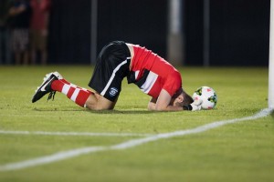BYU goal keeper lays on the ground after losing to Harpo's FC. The game went to penalty kicks after two overtime periods and regulation remained scoreless. (Ari Davis)