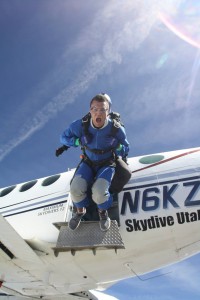 First-time jumper screams while taking the jump from the airplane. Airplanes open the doors to let jumpers out above 13,500 feet. (Skydive Utah)