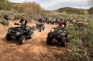 FILE - This May 10, 2014, file photo, ATV riders cross into a restricted area of Recapture Canyon, north of Blanding, Utah, in a protest against what demonstrators call the federal government's overreaching control of public lands. A southern Utah county commissioner and three others on trial in federal court crossed the line when they knowingly broke the law during an ATV protest ride last year through a canyon home to Native American cliff dwellings, prosecutors said Wednesday, April 29, 2015. (Trent Nelson/The Salt Lake Tribune via AP, File)