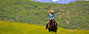 Horseback rider comes back to the ranch after a scenic ride through the mountains. Rocky Mountain Outfitters guides several tours a day. (RMO)