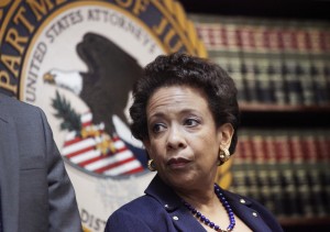 Attorney General Loretta E. Lynch announces an indictment against nine FIFA officials and five corporate executives for racketeering, conspiracy and corruption at a news conference, Wednesday, May 27, 2015, in the Brooklyn borough of New York. Nine of the 14 that were indicted by the Justice Department are soccer officials, while four are sports marketing executives and another works in broadcasting. (AP Photo/Mark Lennihan)