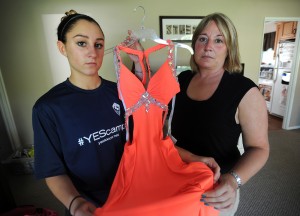 In this photo taken May 11, 2015, Shelton High School sophomore Kylee Opper, 15, left, and her mom Tricia Marini, hold one of two prom dresses that they purchased which have been deemed inappropriate according to a newly announced prom dress code at the school in Shelton, Conn. (AP) 