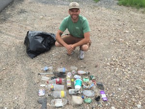 Josh Scheuerman poses by the trash that he picked up from just one-half mile of Big Cottonwood Canyon. Scheuerman has collected more than 300 pounds of trash while running his way through the state. (McCall Frampton)