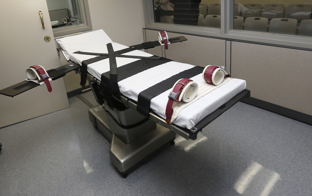 This Oct. 9, 2014, file photo shows the gurney in the the execution chamber at the Oklahoma State Penitentiary in McAlester, Okla. On Monday, June 29, 2015, The Supreme Court voted 5-4 in a case from Oklahoma saying that the sedative midazolam can be used in executions without violating the Eighth Amendment prohibition on cruel and unusual punishment. (AP Photo/Sue Ogrocki, File)