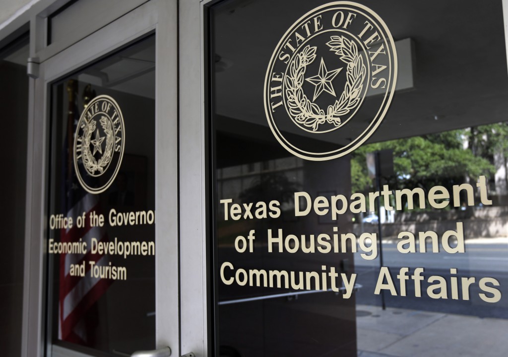 FILE - In this Aug. 30, 2014 file photo, the Texas Department of Housing and Community Affairs is seen in Austin, Texas. The Supreme Court handed a major victory to the Obama administration and civil rights groups on Thursday when it upheld a key tool used for more than four decades to fight housing discrimination. The justices ruled 5-4 that federal housing laws prohibit seemingly neutral practices that harm minorities, even without proof of intentional discrimination. The case involved an appeal from Texas officials accused of accused of violating the Fair Housing Act by awarding federal tax credits in a way that kept low-income housing out of white neighborhoods. (AP Photo/Eric Gay, File)