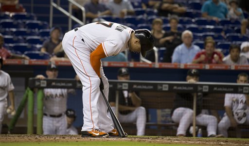 Miami Marlins' Giancarlo Stanton reacts after striking out during the ninth inning of a baseball game in Miami against the Los Angeles Dodgers, Friday, June 26, 2015. (AP Photo/J Pat Carter)