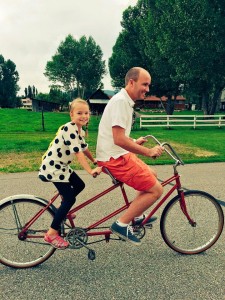 Lt. Governor Spencer Cox and his daughter enjoy a summer bike ride on the farm.  Spencer and his wife,  Abby are grateful for the lesson that living in a small town can teach their children. (Spencer J. Cox)