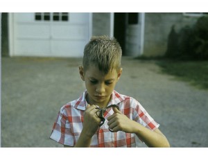 A 7-year-old Jack Sites examines a Prairie Kingsnake, a species common in rural Tennessee.  Every summer Sites' dad helped him build cages and tanks for all sorts of animals until they had a sort of backyard zoo.  (Courtesy Jack Sites) 