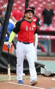 United States' Kyle Schwarber walks out of the batting cage during batting practice before the All-Star Futures baseball game against Team World, Sunday, July 12, 2015, in Cincinnati. (AP Photo/John Minchillo)
