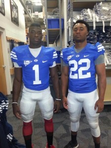 Charles West (left) and Bradon Rice (right) try on BYU jerseys during a 2014 football camp. West was shot in the arm at the beginning of July. (Twitter)