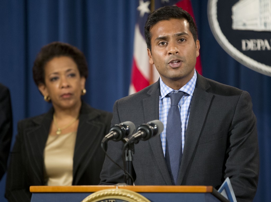 In this June 18, 2015, photo, Shantanu Agrawal, deputy administrator for program integrity and director of the center for program integrity at the Centers for Medicare & Medicaid Services, speaks during a news conference at the Justice Department in Washington. Attorney General Loretta Lynch listens at left. Medicare says its computerized fraud prevention system identified $454 million in problematic payments and generated a financial return for the taxpayer of $10 for every dollar spent last year. (AP Photo/Pablo Martinez Monsivais)