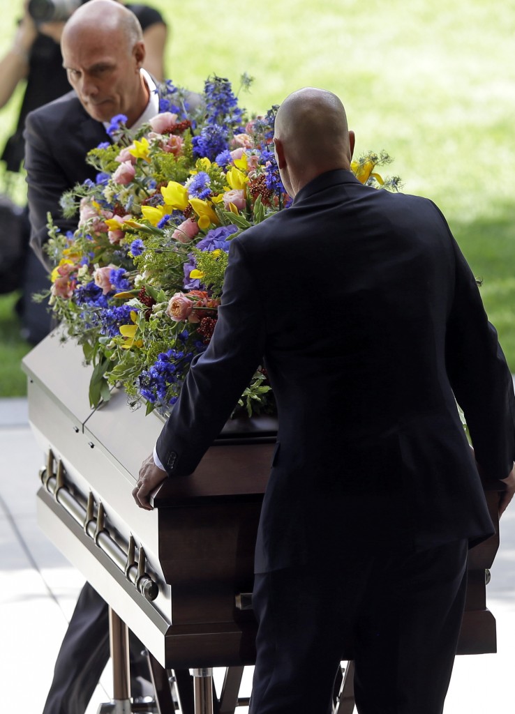Pallbearers carry the casket of Mormon leader Boyd K. Packer during a memorial service at the Tabernacle, on Temple Square Friday, July 10, 2015, in Salt Lake City. Packer's death on July 3 at the age of 90 from natural causes left the religion with two openings on a high-level governing body called the Quorum of the Twelve Apostles. (AP Photo/Rick Bowmer)