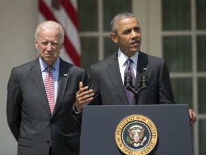 President Barack Obama, accompanied by Vice President Joe Biden, speaks in the Rose Garden of the White House in Washington, Wednesday, July 1, 2015. The president announced that US and Cuba have agreed to open embassies in each other's capitals, the biggest tangible step in the countries' historic bid to restore ties after more than a half-century of hostilities. (AP Photo/Pablo Martinez Monsivais)