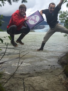 Matt Porter and Brendan Flanery jump for joy in Mendenhall Glacier, Alaska, after finding the BYU50 box. The BYU50 promotion is to get fans excited for football season. (BYU Athletics)