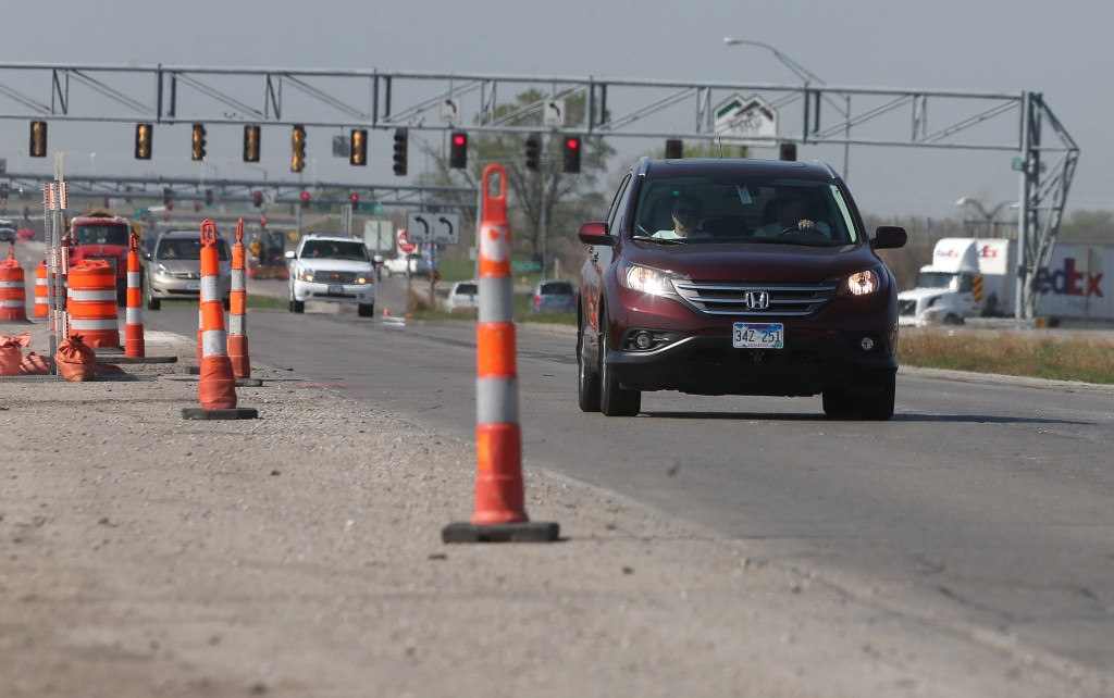 Motorists drive through a construction zone in Altoona, Iowa on April 17, 2015. Traffic deaths in the U.S. are up 14 percent in the first six months of this year and injuries are up by a third, according to data from all states gathered by the National Safety Council. (Bryon Houlgrave/The Des Moines Register via AP)