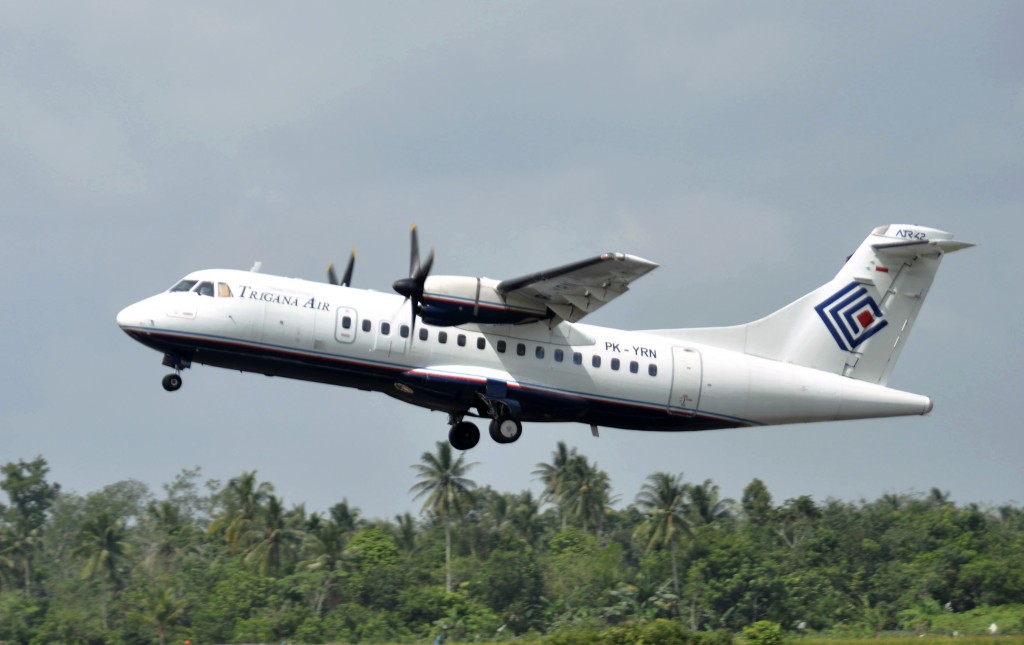 Trigana Air Service's ATR42-300 twin turboprop plane takes off at Supadio airport in Pontianak, West Kalimantan, Indonesia. The same type of a Trigana airliner carrying 54 people was missing Sunday, Aug. 16, 2015 after losing contact with ground control during a short flight in bad weather in the country's mountainous easternmost province of Papua, officials said. (AP Photo)