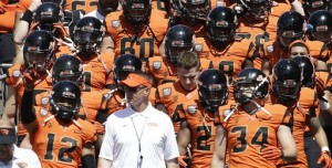 FILE - In this April 18, 2015, file photo, Oregon State coach Gary Anderson walks onto the field with the orange squad before their NCAA college football spring game in Corvallis, Ore. The Pac-12's only new coach this fall realized he was rejoining a league with remarkable talent and several blossoming programs that are sure to make life tough on Saturdays. (AP Photo/Don Ryan, File)