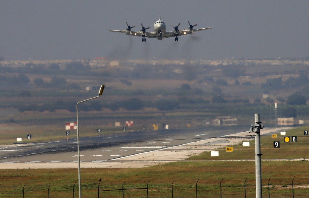 A United States Navy plane approaches to land at the Incirlik Air Base, in Adana, in the outskirts of the city of Adana, southeastern Turkey, Tuesday, July 28, 2015. After months of reluctance, Turkish warplanes started striking militant targets in Syria last week, and also allowed the U.S. to launch its own strikes from Turkey's strategically located Incirlik Air Base. (AP Photo/Emrah Gurel)